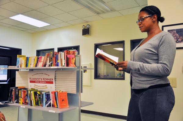 Senior Administrative Assistant Julinda Le Dee read a small passage of her own poetry book, "Rough Edges" at the small memorial reception in honor of her sister who passed away in the language arts department on Oct. 15.