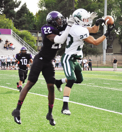 Holland Fisher, defensive back, blocks a passing attempt by Shasta College.