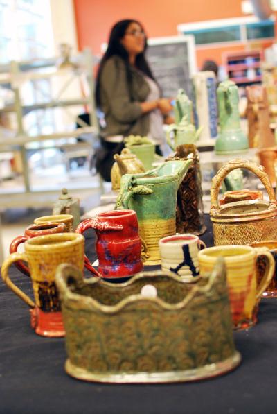 Attendee views items on sale during the ceramics open house on Dec. 8.
