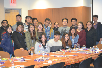 Students and friends of international programs sit together for the Thanksgiving style dinner at SJCC, on Thursday, Nov. 19