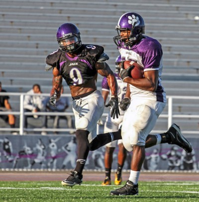 Andres Trevon (No. 23), right, evades Sanders Sidney (No. 9), left, during a practice game at San Jose City College stadium on Sept. 18 before going to West Hill College.