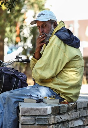 Dan Daniels, a homeless, is chilling with his cigarette in an afternoon near Guadalupe River Trail. 