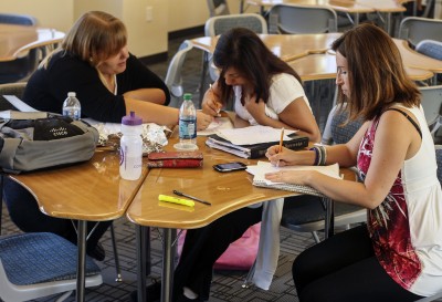 From left: Student Kara Garren, Supplemental Instruction Leader Devon Depew, and Student Sindy Espinoza study together in the Learning Resource Center before going to a mathematics class on Monday, Oct. 1.