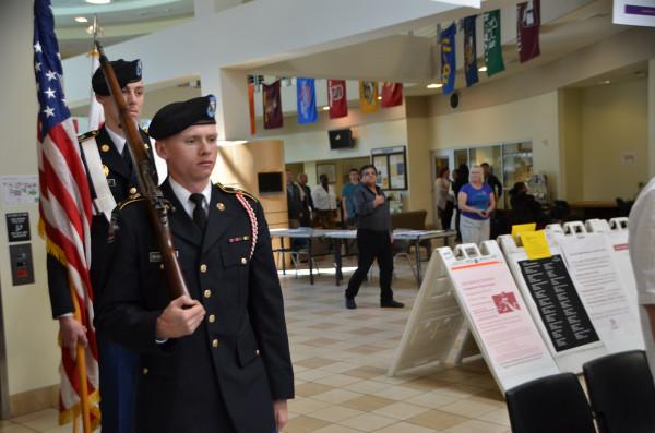 ROTC Cadets Patrick Shanahan and Inn Parrott march the American flag into the Student Center for the pledge of allegiance. 