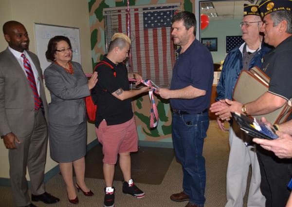From left, President Byron Breland, Chancellor Rita Cepeda, student veterans Michelle Ibanez-Torres and Mic Taylor, and American Legionnaires Gene Grundstrom and Rick Gundo cut the ribbon to the new Veterans Resource Center on the second floor of the Student Center. 