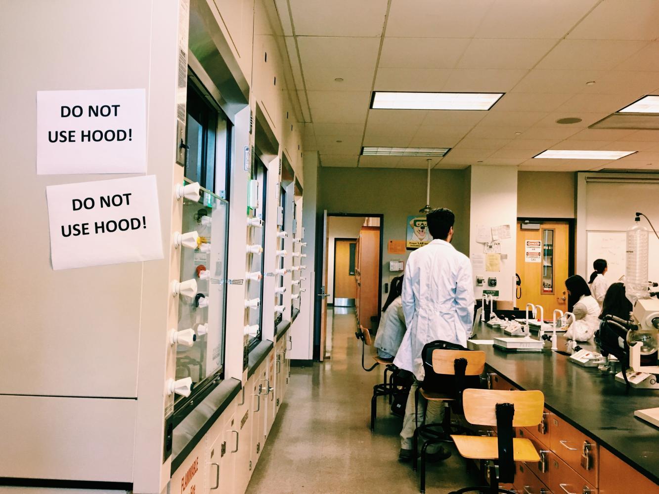 Signs warn students about danger of exposure to broken hoods in the science labs of San jose City College's science building Wednesday, May 3.