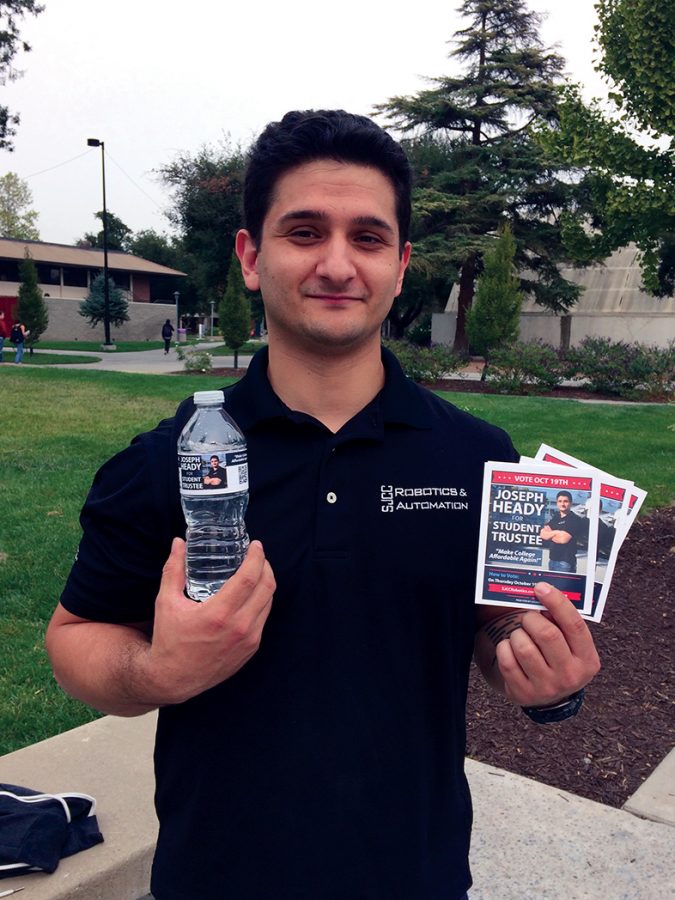 Joseph Heady, new student trustee of SJCC, displays his campaign materials in front of the Business Building on Tuesday, Oct. 17.