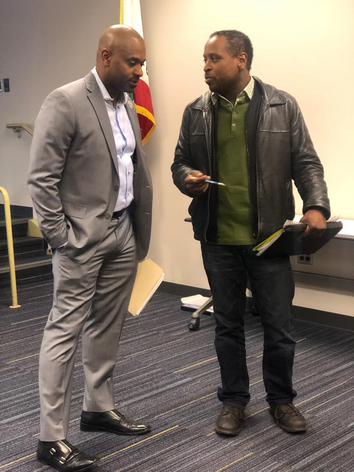 Dr. Breland (left) speaks to Times reporter Reginald Webb at the San Jose City Recognition Ceremony, April 26.