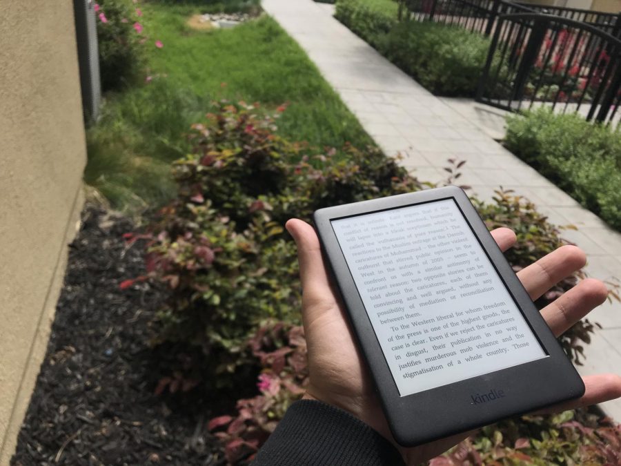 City College Times staff member Anton Vladimir heads to the garden to read with a Kindle e-reader. 