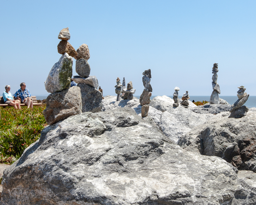 Tourists relax near zen balancing rocks on Westcliff Drive in Santa Cruz, California.