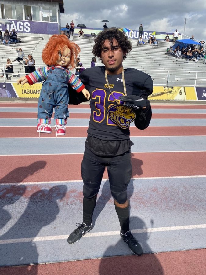 Defensive back Tanner Jones holds up the Chucky doll on the sidelines of the Jaguars OT win over Hartnell on Oct. 30 2021.