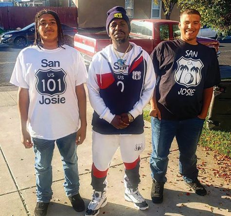 Eric Bowie, also called E Nut, center, poses with his twin sons in a park in San Jose in 2017.