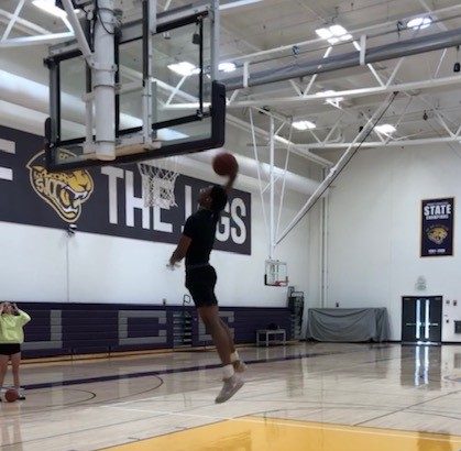 SJCC basketball player practices at Jaguar center on April 26.