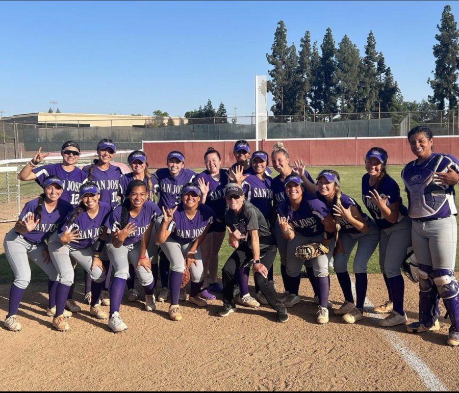 The SJCC Womens Softball team pose after a historic win for their coach in April 2022. 