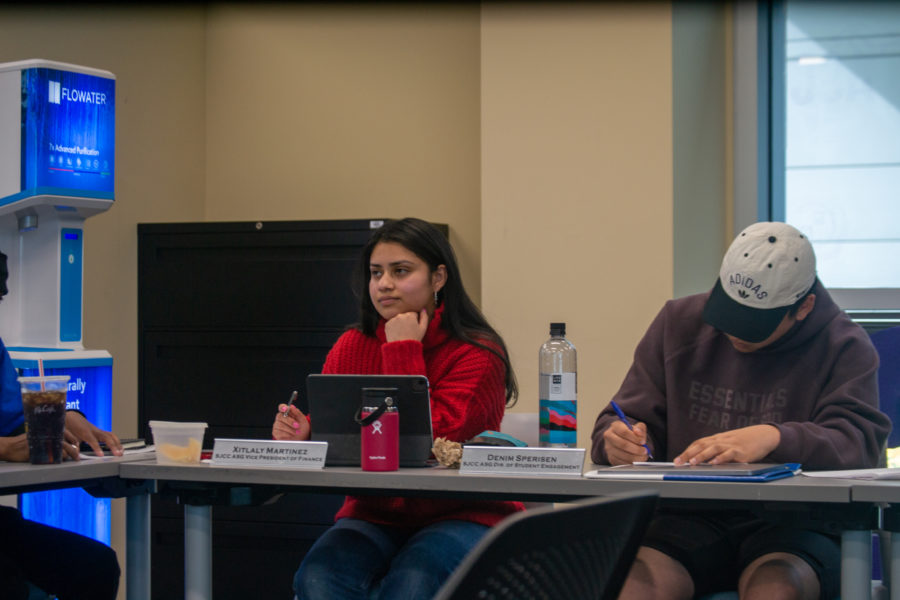 Xitlaly Martinez (left) and Denim Sperisen (right), the vice president of finance and the director of student engagement, listens to the meeting as the student body moves down the approved agenda on Saturday, March 22 in the room where most ASG meeting are held.
