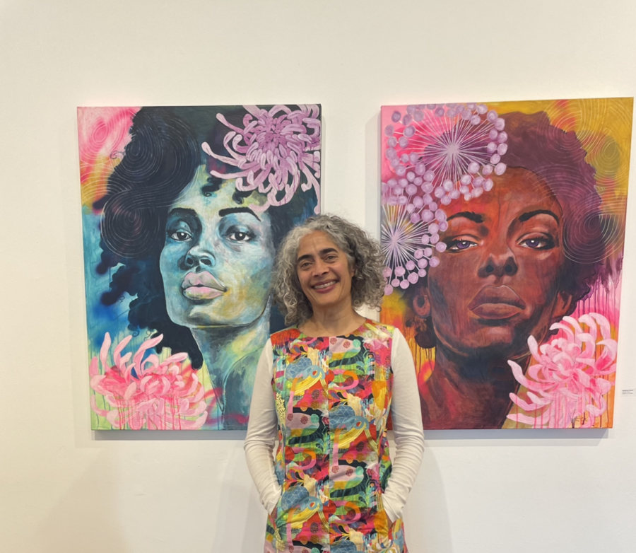 Sharon Virtue showing a couple of paints from her series titled I have a Dream inspired by Martin Luther King speeach.