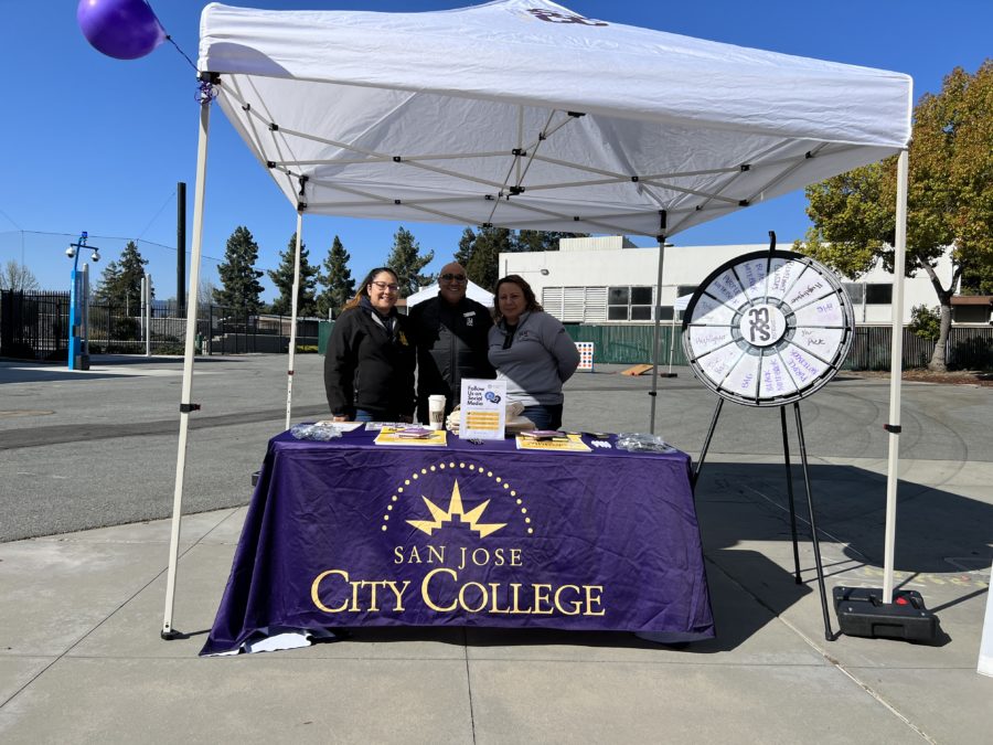 Event volunteer (left), Juan Garcia (Middle), Xiomara Martinez (right), running the sign-up table for the open house outside the Robert N. Chang Student Center on Saturday, March 25.