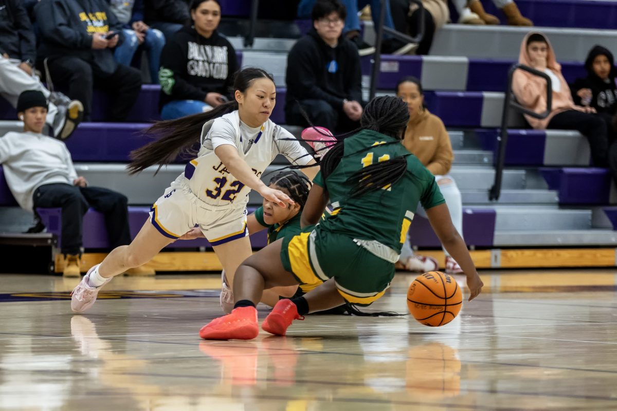 Lady Jaguar guard Christine Lam (left) and Bella Merritt (right) of Napa Valley College hustle for a loose ball in San Jose on February 28, 2024. (Photo by Oscar Lopez)