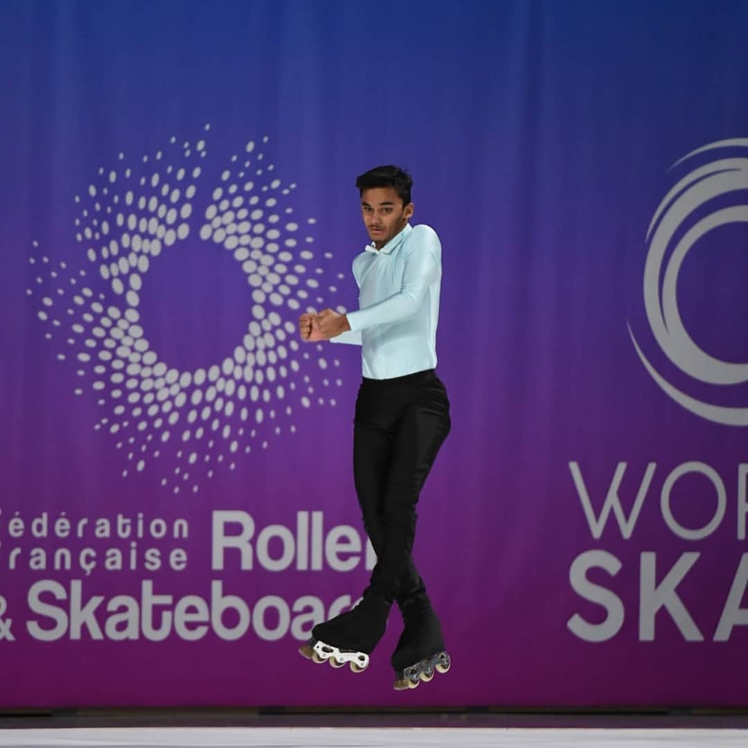 Priyam Tated doing a mid-air twirl at the 2018 Artistic Ice Skating World Championship in La Vendee, France. // Priyam Tated via Instragram