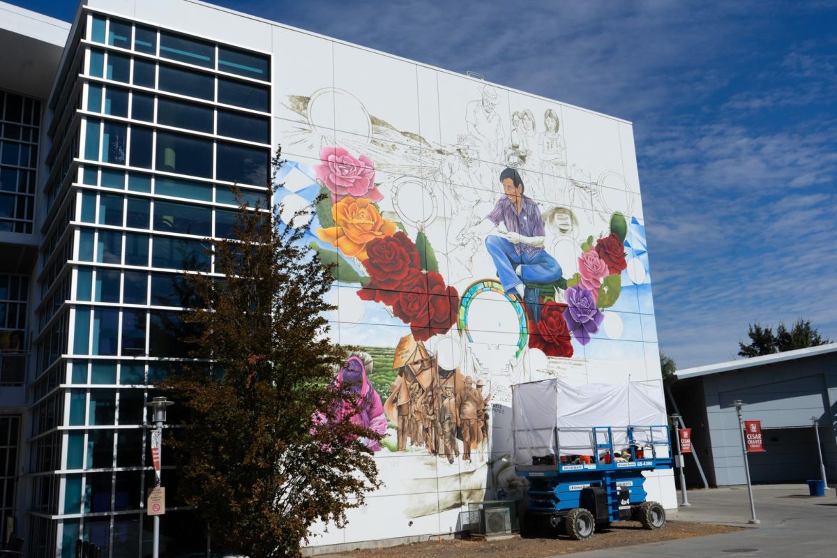 A Mural in progress at the center of SJCC’s campus, filled with symbolic elements depicting Chavez, his family and the resilience of agricultural workers. 