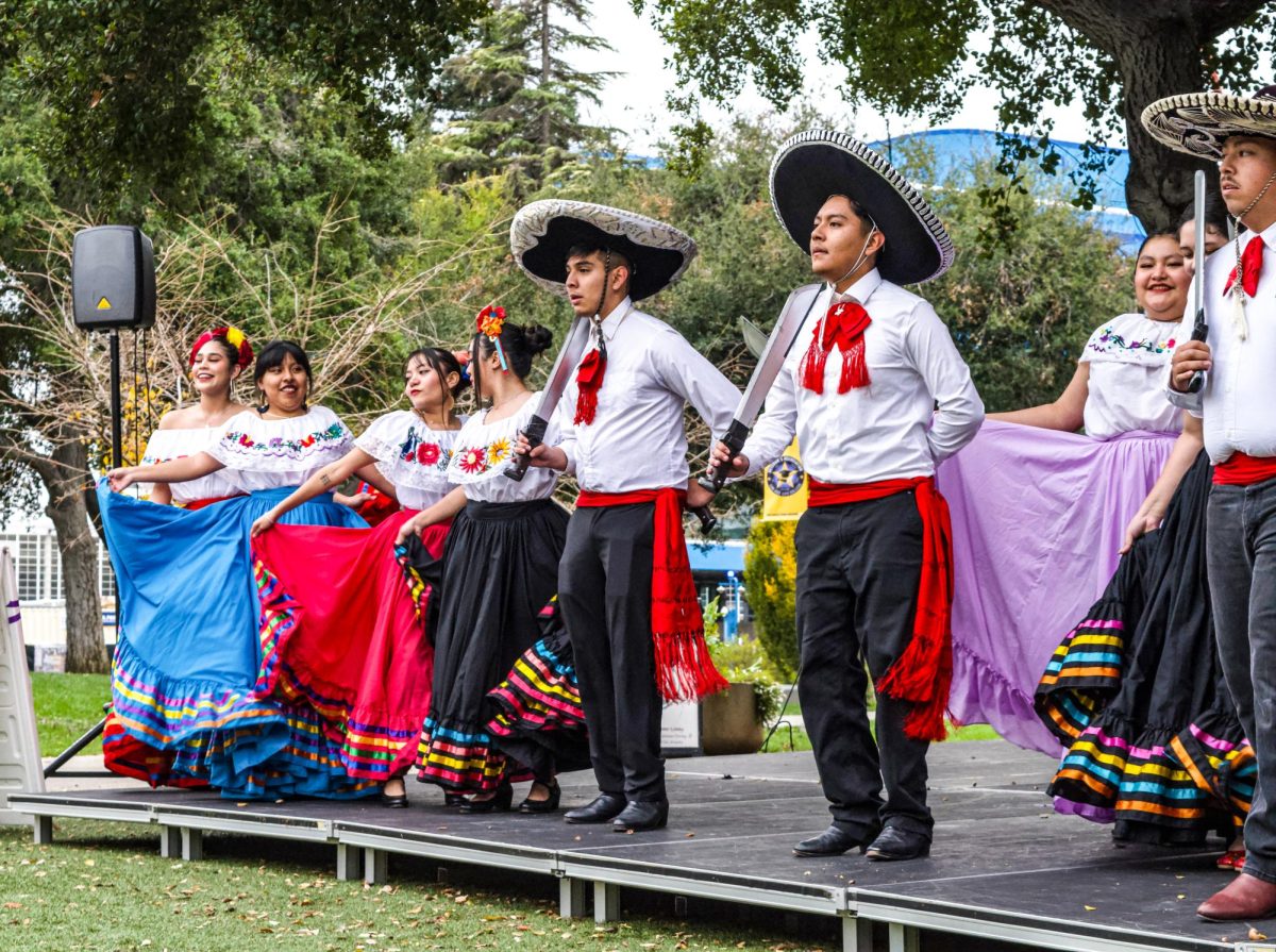 Folklórico dancers with plastic swords line the stage of the Heritage Fesitval on Nov. 19 at SJCC’s GE Quad.