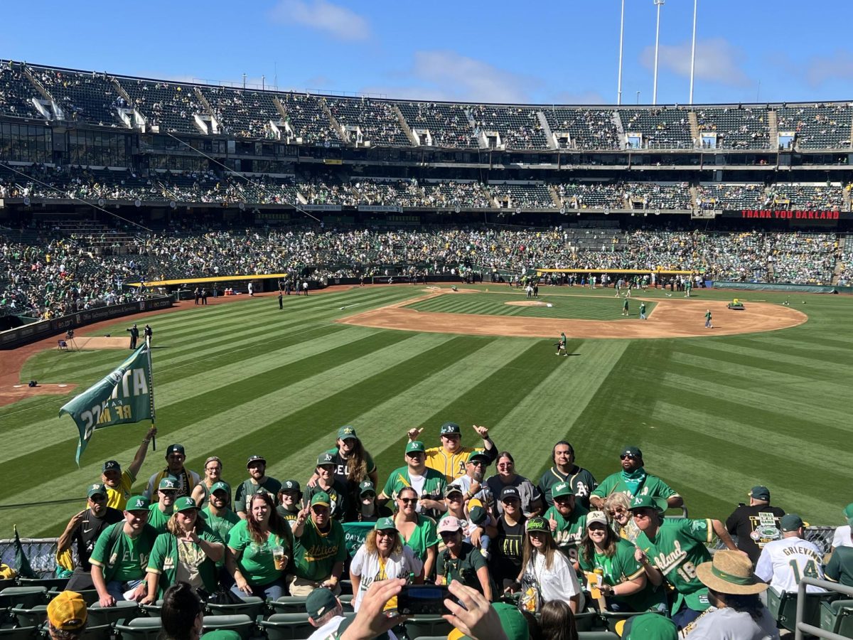 Oakland A's fans take one last group picture in Section 139 at the Last Oakland A's game at the Oakland Coliseum on September 26, 2024 