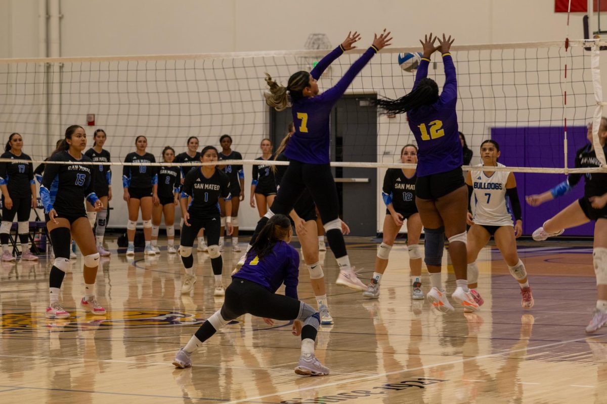 San Jose City College Women's Volleyball Number 7 Kendra Valencia and Number 12 Naima Easter both going up for a block at the net against San Mateo College on October 15.2025