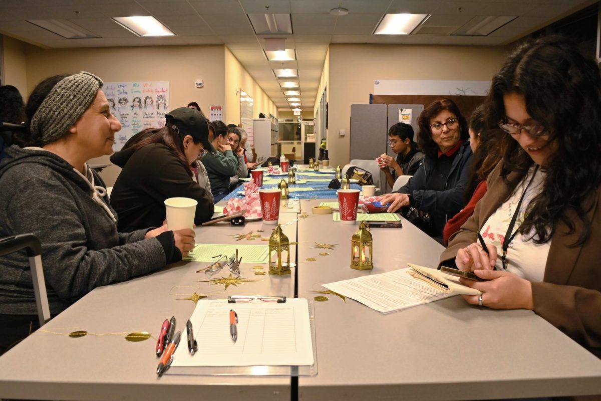 Students discuss stories during MENASA's 1001 Nights event.